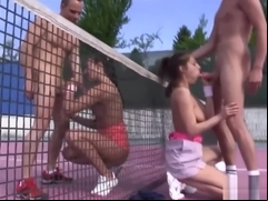 Two teens banged on a tennis court